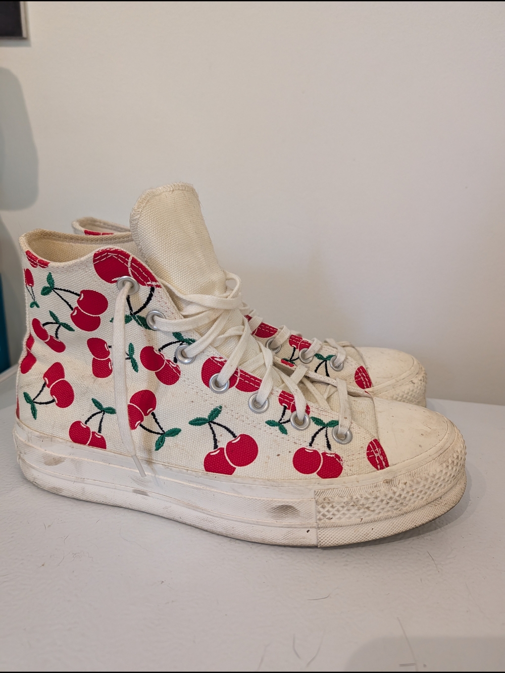 Converse Cream High-Top Sneakers with Red Cherry Accent